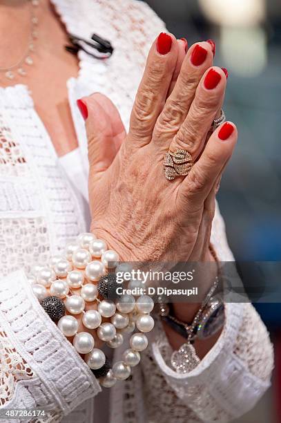 Sharon Osbourne, ring/bracelet detail, visits "Extra" at their New York studios at H&M in Times Square on September 8, 2015 in New York City.