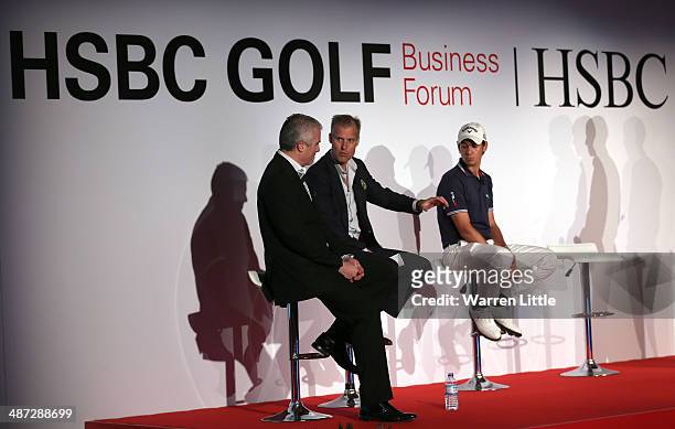 Matteo Manassero of Italy joins speakers on stage to address the 2014 HSBC Golf Business Forum at The Westin Hotel at Abu Dhabi Golf Club on April...