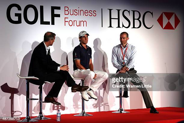 Matteo Manassero of Italy joins speakers on stage to address the 2014 HSBC Golf Business Forum at The Westin Hotel at Abu Dhabi Golf Club on April...