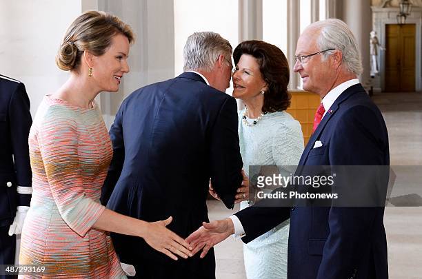 Official visit of Belgian Sovereigns to Sweden on April 29, 2014 in Stockholm, Sweden. Queen Mathilde and King Philippe pictured with King Carl...
