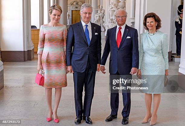 Official visit of Belgian Sovereigns to Sweden on April 29, 2014 in Stockholm, Sweden. Queen Mathilde and King Philippe pictured with King Carl...