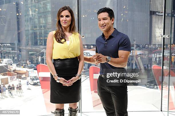 Mario Lopez interviews Taya Kyle during her visit to "Extra" at their New York studios at H&M in Times Square on September 8, 2015 in New York City.