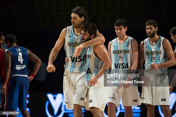 Luis Scola of Argentina celebrates with Facundo Campazzo after winning a second stage match between Argentina and Dominican Republic as part of the...