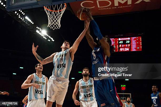 Orlando Sanchez of Dominican Republic fights for a rebound against Gabriel Deck of Argentina during a second stage match between Argentina and...