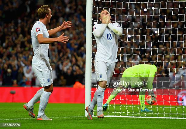 Wayne Rooney of England celebrates scoring their second goal from the penalty spot with Harry Kane of England during the UEFA EURO 2016 Group E...