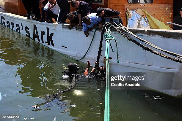 Palestinian boat named Gaza's Ark, which was preparing to break Israel's naval blockade, is damaged in an explosion on April 29, 2014 in Gaza Strip....