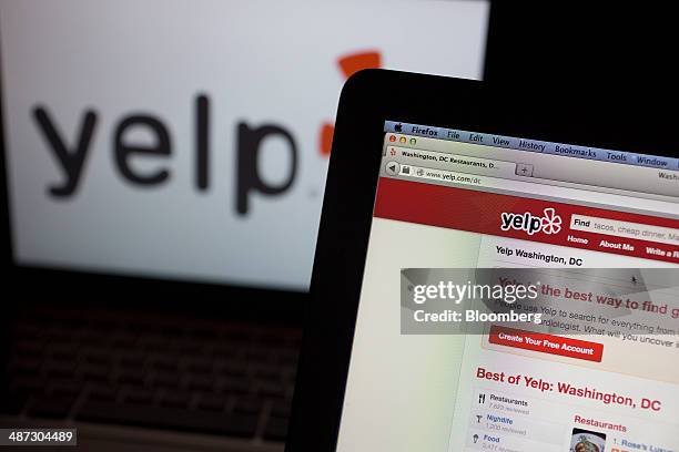 The Yelp Inc. Website and logo are displayed on laptop computers in this arranged photograph in Washington, D.C., U.S., on Friday, April 25, 2014....