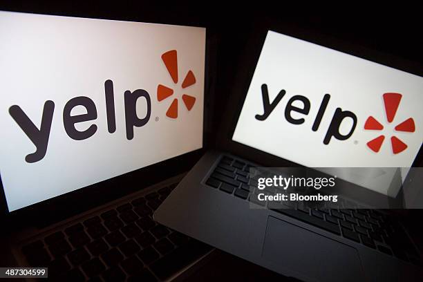 The Yelp Inc. Website and logo are displayed on laptop computers in this arranged photograph in Washington, D.C., U.S., on Friday, April 25, 2014....