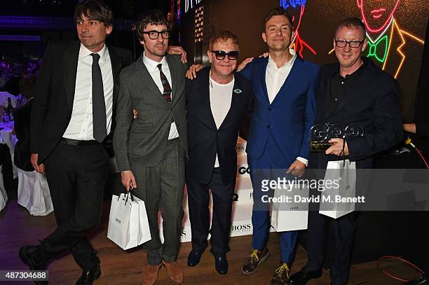 Sir Elton John poses with Band of the Year winners Alex James, Graham Coxon, Damon Albarn and Dave Rowntree of Blur at the GQ Men Of The Year Awards...