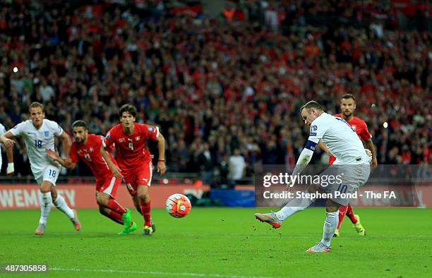 Wayne Rooney of England scores from the penalty spot during the EURO 2016 qualifying match between England and Switzerland at Wembley Stadium on...