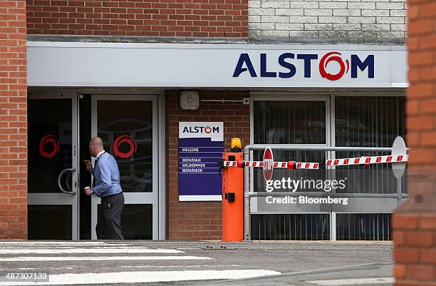 An Alstom employee enters Alstom SA's power plant turbine refurbishment facility in Rugby, U.K, on Tuesday, April 29, 2014. The battle for Alstom...