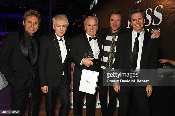 Giorgio Moroder , winner of the Inspiration of the Year award, poses with John Taylor, Nick Rhodes, Simon Le Bon and Roger Taylor of Duran Duran at...