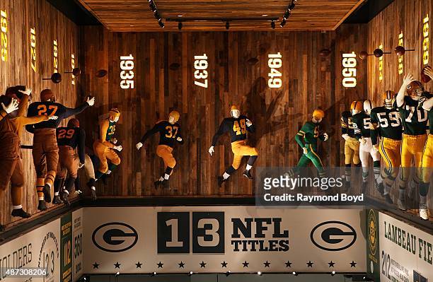 An evolution of Green Bay Packers football uniforms are on display inside the Green Bay Packers 'Hall Of Fame', inside the Lambeau Field atrium on...