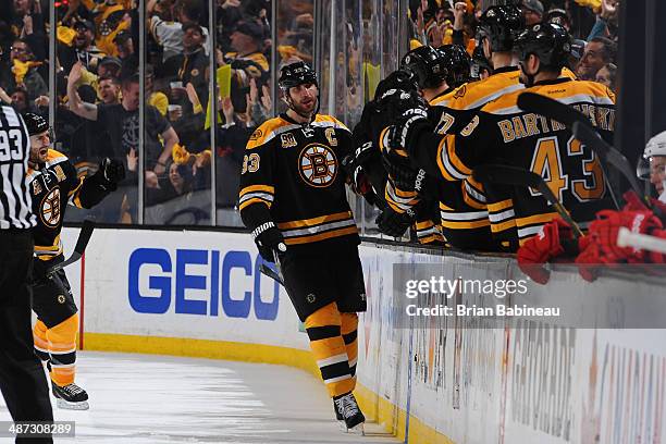 Zdeno Chara of the Boston Bruins celebrates a goal against the Detroit Red Wings in Game Five of the First Round of the 2014 Stanley Cup Playoffs at...