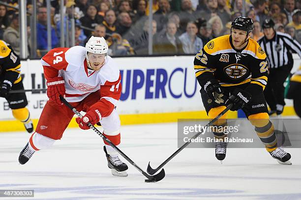 Gustav Nyquist of the Detroit Red Wings skates against Shawn Thornton of the Boston Bruins in Game Five of the First Round of the 2014 Stanley Cup...