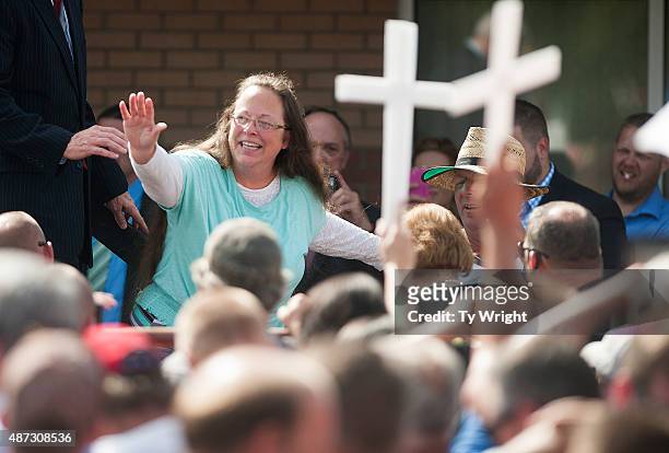 Rowan County Clerk of Courts Kim Davis waves to a crowd of her supporters at a rally in front of the Carter County Detention Center on September 8,...