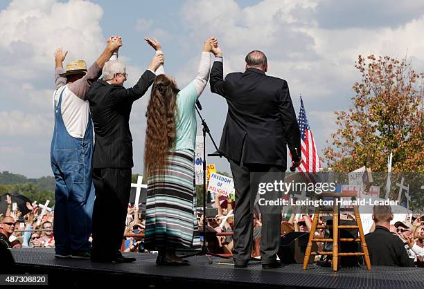 From left, Joe Davis, Mat Staver, Kim Davis and Mike Huckabee at a rally outside the Carter County Detention Center in Grayson, Ky., on Tuesday,...