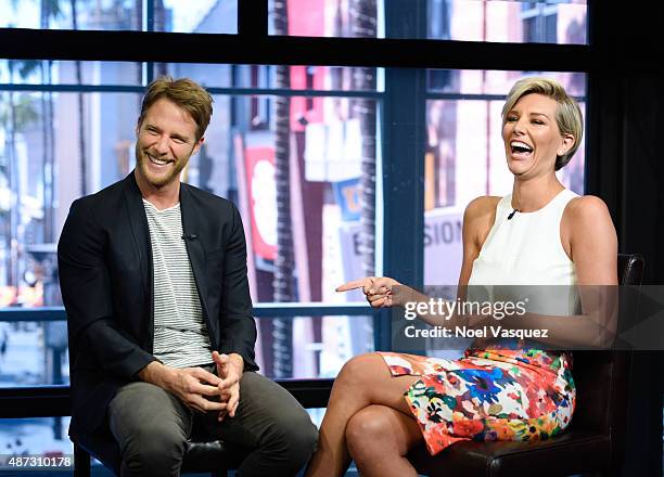 Jake McDorman and Charissa Thompson visit "Extra" at Universal Studios Hollywood on September 8, 2015 in Universal City, California.