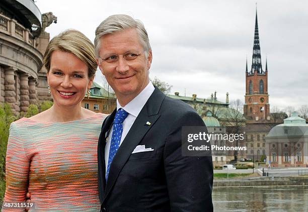 King Philippe and Queen Mathilde of Belgium take a short walk to Rosenbad during their visit to Sweden on April 29, 2014 in Stockholm, Sweden.