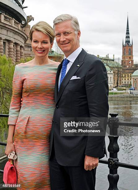 King Philippe and Queen Mathilde of Belgium take a short walk to Rosenbad during their visit to Sweden on April 29, 2014 in Stockholm, Sweden.