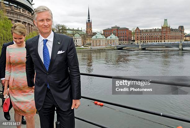 King Philippe and Queen Mathilde of Belgium take a short walk to Rosenbad during their visit to Sweden on April 29, 2014 in Stockholm, Sweden.