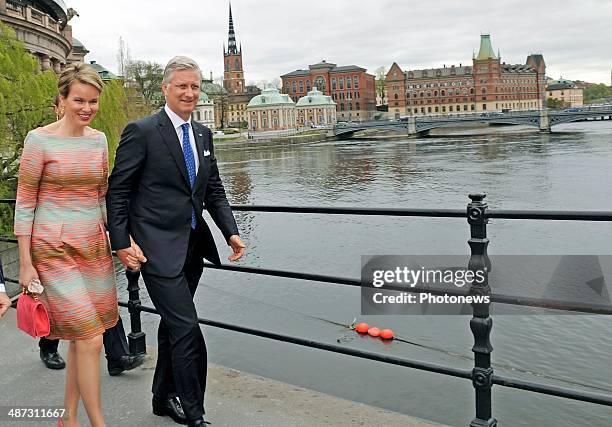 King Philippe and Queen Mathilde of Belgium take a short walk to Rosenbad during their visit to Sweden on April 29, 2014 in Stockholm, Sweden.