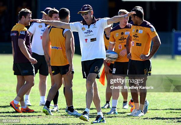 Coach Wayne Bennett enjoys a moment with his players during a Brisbane Broncos NRL training session on September 9, 2015 in Brisbane, Australia.