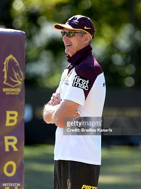 Coach Wayne Bennett gives a smile as he watches on during a Brisbane Broncos NRL training session on September 9, 2015 in Brisbane, Australia.