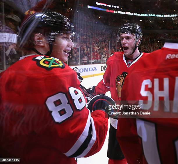 Patrick Kane and Jonathan Toews of the Chicago Blackhawks celebrate Kane's goal against the St. Louis Blues in Game Four of the First Round of the...