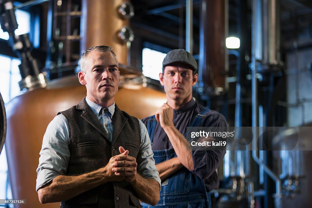 Men working in old distillery