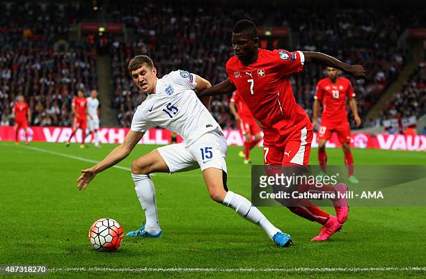 John Stones of England and Breel Embolo of Switzerland during the UEFA Euro 2016 Qualifier Group E match between England and Switzerland at Wembley...