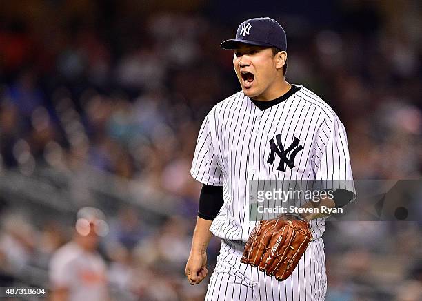Masahiro Tanaka of the New York Yankees reacts after retiring the side in the fifth inning against the Baltimore Orioles at Yankee Stadium on...
