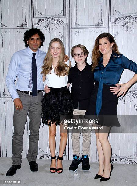 Night Shyamalan, Olivia DeJonge, Ed Oxenbould and Kathryn Hahn pose before discussing "The Visit" during the AOL Build Series at AOL Studios In New...