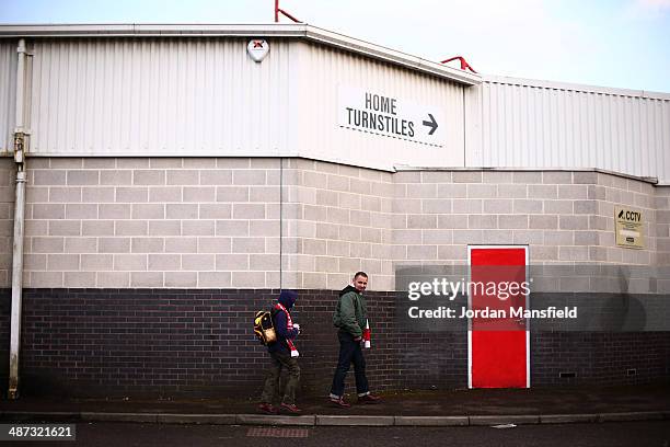 Fans make their way into the stadium ahead of the Sky Bet League One match between Crawley Town and Carlisle United at The Checkatrade.com Stadium on...