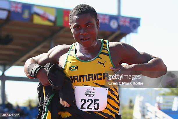 Gold medalist Kevin Nedrick of Jamaica celebrates victory in the boys shot put during the athletics competition at the Apia Park Sports Complex on...