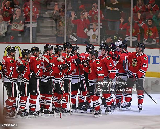 Fans wave towels as the the Chicago Blackhawks celebrate a win against the St. Louis Blues in Game Three of the First Round of the 2014 NHL Stanley...