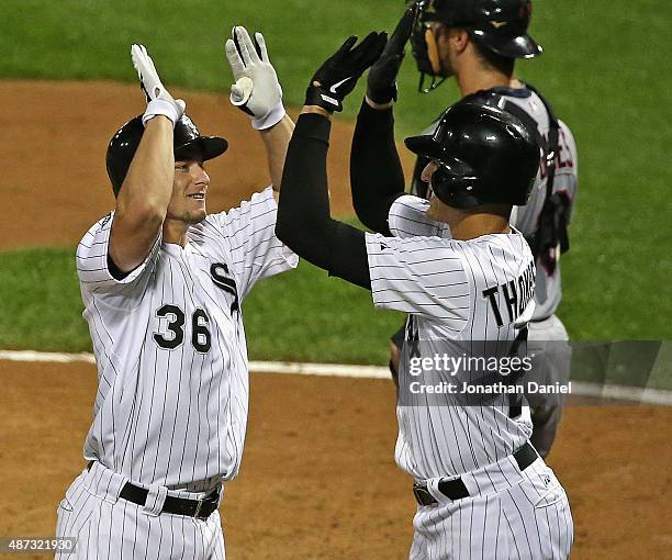 Rob Brantley of the Chicago White Sox celebrates his three-run home run in the 2nd inning against the Cleveland Indians with teammate Trayce Thompson...