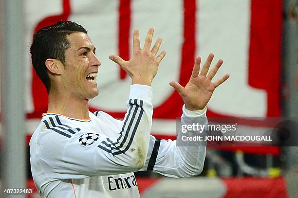 Real Madrid's Portuguese forward Cristiano Ronaldo celebrates scoring and breaking the record for the most goals in a European Cup or Champions...