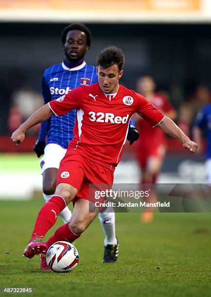 Matt Tubbs of Crawley Town takes the ball past Pascal Chimbonda of Carlisle United during the Sky Bet League One match between Crawley Town and...