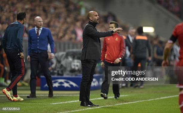 Bayern Munich's Spanish head coach Pep Guardiola gestures during the UEFA Champions League second-leg semi-final football match FC Bayern Munich vs...