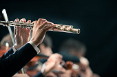 Symphony orchestra performance: flutist close-up