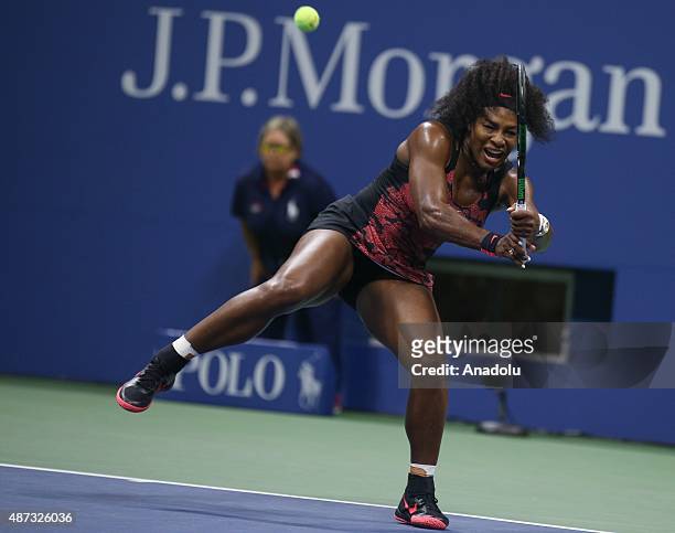 Serena Williams of the United States returns a shot to Venus Williams of the United States during their Women's Singles Quarterfinals match on Day...