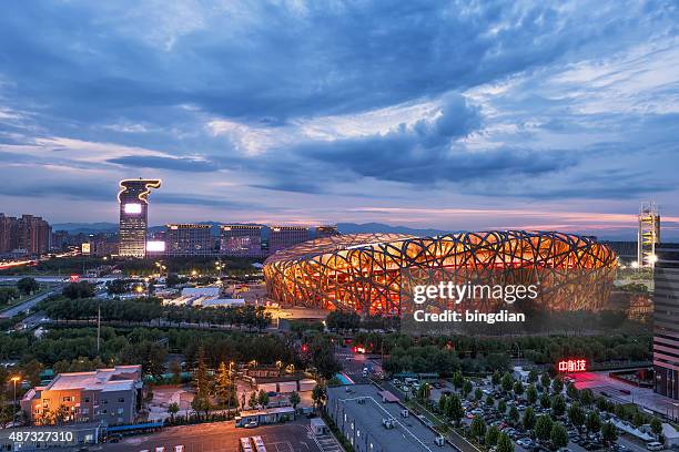the beijing national stadium at night - birds nest stock pictures, royalty-free photos & images