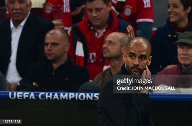 Bayern Munich's Spanish head coach Pep Guardiola reacts during the UEFA Champions League second-leg semi-final football match FC Bayern Munich vs...