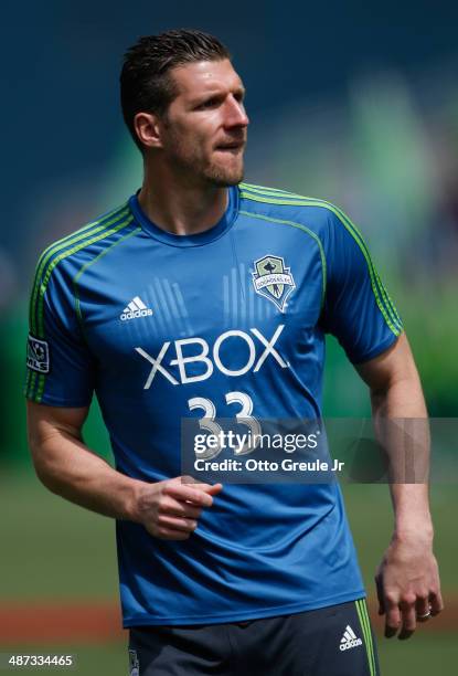 Kenny Cooper of the Seattle Sounders FC looks on prior to the match against the Colorado Rapids at CenturyLink Field on April 26, 2014 in Seattle,...