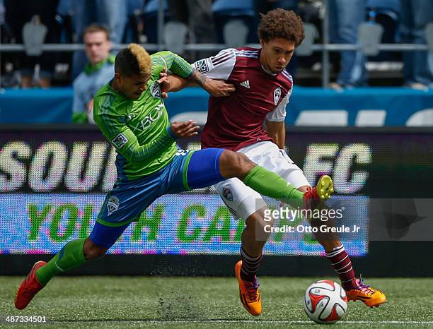 DeAndre Yedlin of the Seattle Sounders FC battles Chris Klute of the Colorado Rapids at CenturyLink Field on April 26, 2014 in Seattle, Washington....