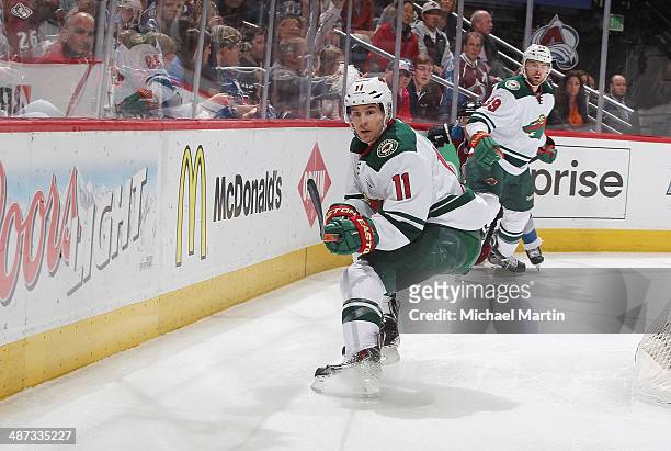 Zach Parise the Minnesota Wild clears the puck against the Colorado Avalanche in Game Five of the First Round of the 2014 Stanley Cup Playoffs at the...