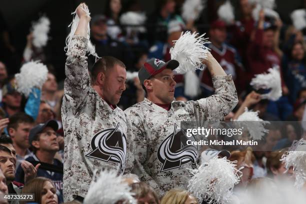 Fans the Colorado Avalanche cheer during the game against the Minnesota Wild in Game Five of the First Round of the 2014 Stanley Cup Playoffs at the...