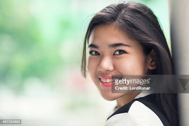 portrait of a young happy female student - filipino girl stockfoto's en -beelden