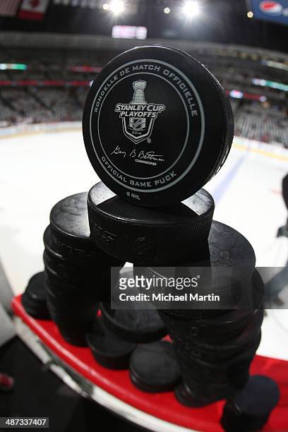 Pucks sit on the bench prior to the Colorado Avalanche against the Minnesota Wild in Game Five of the First Round of the 2014 Stanley Cup Playoffs at...